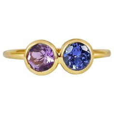 Matching stones together is one of Anna's favorite part of the design process. Here she has carefully matched a beautiful ink blue Tanzanite next to a deep purple Amethyst for their strong and vibrant hues. Set in 18k yellow gold to compliment and balance their natural beauty, we have hidden a four leaf clover for eternal luck. Designed as two birds singing next to one another this ring combines a colourful range of precious gems. Our signature hand pierced lace on the back of each gem allows li Purple Multi-stone Sapphire Ring, Purple Sapphire Multi-stone Rings, Blue Amethyst Anniversary Ring, Purple Multi-stone Sapphire Ring Gift, Purple Multi-stone Sapphire Ring As A Gift, Gift Purple Multi-stone Sapphire Ring, Purple Sapphire Ring With Bezel Setting As Gift, Anna Molinari, Hand Piercing