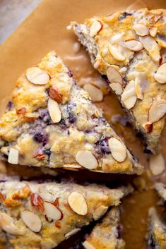 blueberry almond scones are stacked on top of each other and ready to be eaten