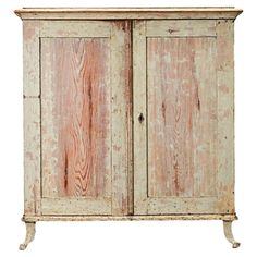 an old wooden cabinet with two doors