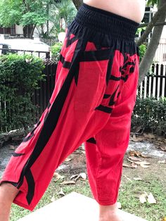 "Male Model Tall 5'9\" Waist 34\" Samurai Pants - elastic waistband Fits all! Unisex pants These beautiful casual pants is unique & comfortable to wear Handmade with a very lovely pattern, it is easy to wear and great for many occasions. One size fits most. These pants are great for many different activities like traveling, dancing, going to festivals, rock climbing, yoga, meditation, massage, working out, martial arts, Taichi MATERIAL: 100% Cotton APPROX MEASUREMENT: Waist: 24\"- 40\" Lengt Casual Red Harem Pants, Casual Red Harem Pants For Festival, Yoga Harem Pants, Samurai Pants, Handmade Pants, Unisex Pants, Black Pants Men, Trouser Style, Rock Climbing