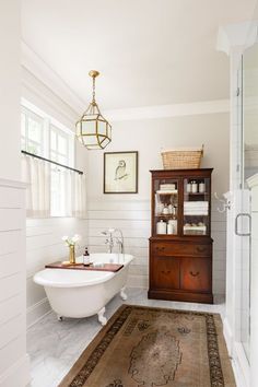 a bathroom with a sink, toilet and bathtub