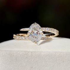 an engagement ring set with a pear shaped diamond