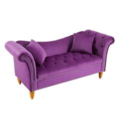 a purple couch with some pillows on it