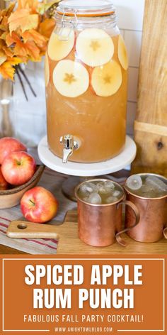 spiced apple rum punch with apples in the background and text overlay that reads spiced apple rum punch