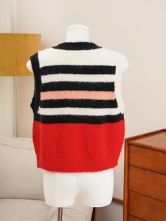 Made with a blend wool, this vest offers superior insulation and comfort. The classic striped design adds a touch of sophistication, making it a versatile addition to any wardrobe. - Color: Red- Style: Vest- Pattern Type: Stripes- Sleeve Length: Sleeveless- Fabric: Wool- Closure Type: Button- Collar Type: Round Neck- Fit Type: Regular Fit- Occasion: Casual- Gender: Women- Size: S, M SIZE CHART (cm) SIZE Shoulder Bust Length S 36 94 47 M 36 100 49 1inch = 2.54 cm, 1cm = 0.39 inch Casual Striped Knit Vest, Striped Knit Sleeveless Sweater Vest, Red Knit Sleeveless Sweater Vest, Casual Striped V-neck Sweater Vest, Chic Striped V-neck Vest, Niche Design, Chic Sweaters, Striped Sleeve, Vest Pattern