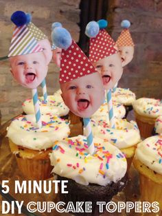 cupcakes with faces and candles on them