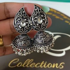 Gold Color Oxidised Earrings Earring Length: 6.00 Cm X Width: 3.00 Cm Metal: Alloy With Good Quality Gold Plated Color: Gold | Stone: Beads Gross Weight: 28.00 Grams Package Content: 1 Pair Of Earrings Back Finding: Post With Friction Back X Earring Style: Jhumka Care Instruction : Avoid Heat & Chemicals Like Perfume, Deo, Alcohol, Etc. | Clean With Dry Cotton Cloth | Pack In An Air Tight Container After Use. Oxidized Finish Jhumkas For Gift, Gift Oxidized Finish Jhumkas, Ornate Jhumkas For Pierced Ears, Traditional Danglers For Anniversary, Vintage Metal Danglers, Vintage Earrings With Latkans, Metal Teardrop Earrings For Anniversary, Vintage Jhumkas For Festive Occasions, Vintage Jhumkas For Festive Gift