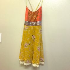 This Dress Has Everything On It That Makes For A Super Cute Pattern. The Back Is Criss Cross And The Bottom Part Flares Out. Worn Only Once! Orange Flowy Sundress Mini Dress, Flowy Orange Sundress Mini Dress, Flowy Orange Mini Sundress, Orange Flowy Mini Sundress, Orange Bohemian Mini Sundress, Orange Sleeveless Sundress For Party, Orange Sundress Midi Dress, Orange Sleeveless Bohemian Midi Dress, Bohemian Orange Sleeveless Midi Dress