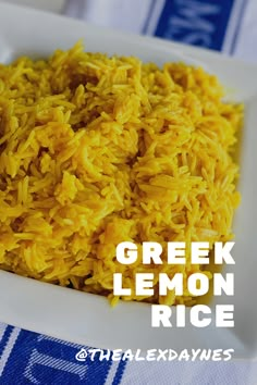 a white bowl filled with yellow rice on top of a blue and white table cloth