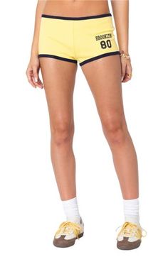 Rep your favorite city in these sporty, stretchy cotton shorts designed in a leggy silhouette with contrasting trim. Pull-on style 95% cotton, 5% spandex Machine wash, dry flat Imported Hygiene Tips, Micro Shorts, Shorts Y2k, Yellow Fits, Contrasting Trim, Yellow Shorts, Designer Shorts, Yellow Stripes, Wide Leg Denim