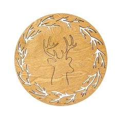 a wooden plate with an image of a deer in the center and leaves around it