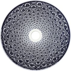 a black and white circular bowl with an intricate design on the bottom, surrounded by smaller circles