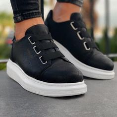 Step into the world of "Luiz Monochrome Mastery." These slip-on sneakers elegantly pair a deep black vegan leather with contrasting white soles, designed for those with a penchant for classic contrasts and unparalleled comfort. Key Features: Black & White Fusion: A timeless pairing that never goes out of style. Slip-On Design: For instant sophistication without the fuss. Vegan Leather: Ethical elegance, seamlessly achieved. Orthopedic Insoles: Ensuring comfort with every move. 1.5-Inch Height Bo New Trend Shoes, Black And White Sneakers, Lightweight Sneakers, Black Shoes Women, Women Men Shoes, Custom Sneakers, Sneakers Men Fashion, Classic Sneakers, Black Sneakers