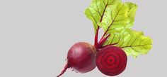 two radishes on top of each other with green leaves