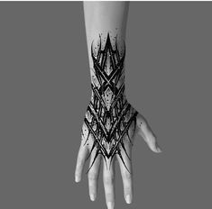 a person's hand with black and white ink designs on it, holding out their arm