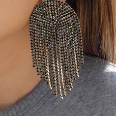 Lightweight Material: gold plated brass, crystals Drop: 3.5" For pierced ears IMPORTED Gold Crystal Jewelry With Rhinestone Fringe, Metal Chandelier Earrings With Bling, Gold Rhinestone Fringe Metal Jewelry, Gold Metal Jewelry With Rhinestone Fringe, Glamorous Gold Plated Crystal Earrings For Party, Gold Rhinestone Crystal Earrings, Glamorous Gold Jewelry With Rhinestone Fringe, Glamorous Gold Rhinestone Fringe Jewelry, Gold Crystal Chandelier Earrings With Rhinestones