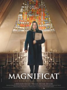 the movie poster for magnificat with a woman holding a piece of paper