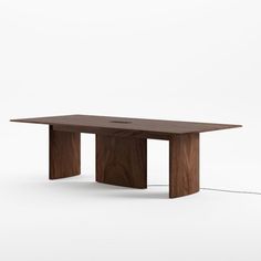 a wooden table sitting on top of a white floor