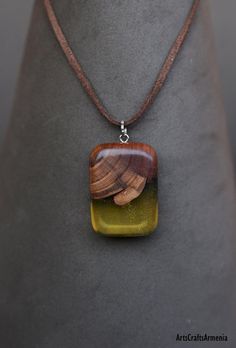 Light green pendant necklace Brawn wooden jewelry Cosmic art wood gift for women Modern Nature necklace for girlfriend Armenian jewelry Leather chain necklace If you want it to сome with special wooden box please choose in the options - wooden gift boxPendant height: 4.5Pendant width: 2.5Necklace length: You can choose your preferred length and write me, if not I will send medium length 70 cm. Material: Apricot wood, natural high quality resinEach piece is unique, handmade and has unique charact Brown Wooden Necklace For Gifts, Adjustable Natural Wood Pendant Jewelry, Natural Wood Pendant Necklace, Vintage Boho Outfit, Brown Wooden Pendant Jewelry, Green Pendant Necklace, Nature-inspired Wooden Pendant Jewelry, Armenian Jewelry, Jewelry Wood