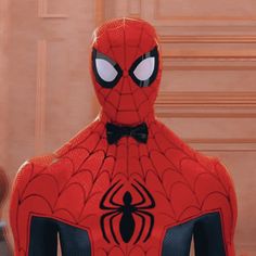 the spider - man is wearing a bow tie