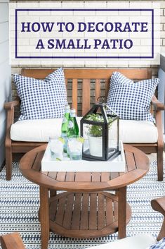 a wooden bench sitting on top of a patio next to a table with bottles and glasses