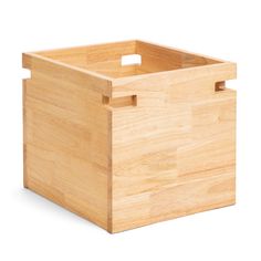 an empty wooden box with handles on a white background