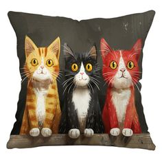 three cats sitting on top of a pillow with yellow eyes and one cat looking at the camera