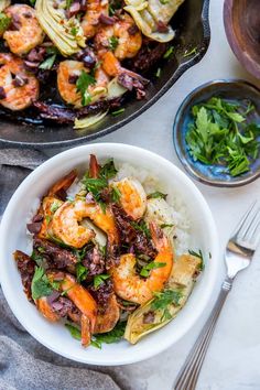 shrimp and vegetable stir fry in a skillet with rice