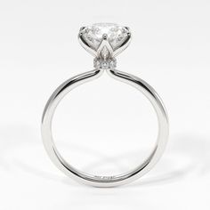 a white gold engagement ring with an oval cut diamond