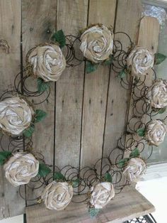 a wreath made out of wire and flowers