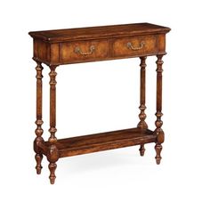 an antique console table with two drawers