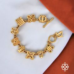 Embrace tradition and style with the Adinkra Legacy Bracelet. This exquisite piece, featuring 18k gold plating and authentic Adinkra symbols, celebrates African heritage and craftsmanship. Perfect for any special occasion or as a meaningful gift. Discover more at Adinkra Charms. #AdinkraLegacy #AfricanJewelry Adinkra Tattoo, Gye Nyame, Adinkra Symbols, Earthy Jewelry, African Heritage, Stacked Necklaces, School Dance, Symbolic Tattoos, Unique Bracelets