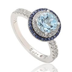 Suzy Levian Round-Cut Blue Topaz, Sapphire and White Topaz Ring  This beautiful blue topaz, sapphire and white topaz ring carries a message from designer Suzy Levian in the form of her signature "hidden diamond," set inside the shank. By creating jewelry that is beautiful inside and out, she hopes to empower women to discover their own inner strength, power and beauty.         Approx. 0.43"L x 0.43"W x 0.31"H; shank 0.08"W     Stamped .925     Sterling silver ring has round-cut blue topaz solita Gemstone Brooch, Personal Jewelry, Cubic Zirconia Bracelet, Ring Shank, Blue Topaz Gemstone, Cubic Zirconia Jewelry, Double Halo, Beautiful Inside And Out, Creating Jewelry