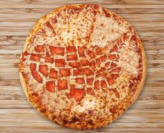 a pizza with cheese and pepperoni on a wooden surface