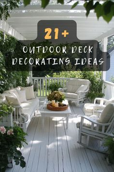 an outdoor deck decorated with white furniture and flowers