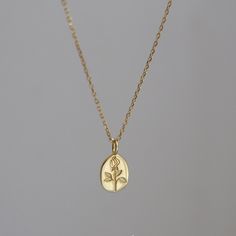 This dainty handmade necklace features a oval shaped signet pendant that has been engraved with exquisite rose flower. Gold and silver tone of your choice. Minimalism delicate design, makes it perfect for layering and stacking, adding a touch of sophistication to any of your outfit. It is also a amazing gift idea for for anyone who loves subtle modern aesthetics. Simple yet unique, elegant yet with attitude. 💎 Features: ♥ Handmade necklace ♥ Finish: 14K gold vermeil/925 sterling silver ♥ 17" + Dainty Oval Sterling Silver Charm Necklaces, Elegant Oval Pendant Necklaces With Flower Charm, Dainty Sterling Silver Jewelry With Rose Design, Elegant Oval Pendant Necklace With Flower Charm, Gold Rose Design Necklace In Sterling Silver, Gold Sterling Silver Necklace With Rose Design, Dainty Oval Engraved Charm Necklaces, Dainty Engraved Oval Charm Necklaces, Dainty Engraved Oval Charm Necklace