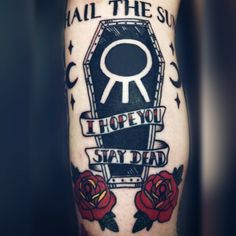 a man with a tattoo on his arm that says hail the sun, hope you stay dead