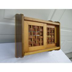 a wooden box with some sort of design on it