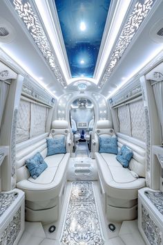 the inside of an airplane with couches and tables