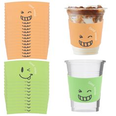 three different colored cups with faces drawn on them