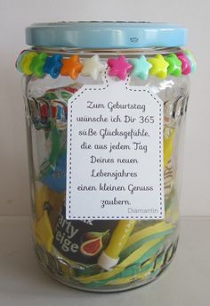 a jar filled with lots of different colored candies