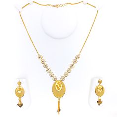 Unveil the allure of tradition with this 22k gold necklace set. Boasting a breathtaking oval design, the necklace weighs 19.2 grams and features an exquisite dangle. With a set length of 19" and a drop of 2.5", it offers an elegant look. Tailor the fit using 0.8" adjustable links and secure with a lobster ring lock. Complete the ensemble with matching 2" earrings featuring convenient push-back posts. PRODUCT DETAILS Gold Purity(karat): 22k Gold Weight(grams): 19.2 Item Finish: Yellow Gold Set Le Gold Oval Necklace With Elegant Design, Oval Gold Necklace With Elegant Design, Gold Oval Jewelry Set For Wedding, Traditional Oval Yellow Gold Necklaces, Oval Gold Jewelry Set For Wedding, Traditional Oval Yellow Gold Necklace, Traditional Yellow Gold Oval Necklace, Formal Gold Oval Jewelry Set, Formal Oval Gold Jewelry Set