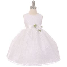 a white flower girl dress on a mannequin