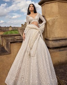 This ivory lehenga set features intricate embroidery in thread, pearl and sequin in a linear pattern. The full sleeves blouse shows exaggerated tassels at the wrist. The dupatta has four sided heavy embroidery with a jaal in the centre.From Seema Gujral's A Royal Affair collection. DELIVERY TIMEPlease allow 8-12 weeks Reception Outfit For Bride Indian, Indian Wedding Outfit Bride, Pearl Lehenga, Wedding Lehengas Bridal, Full Sleeves Blouse, Indian Wedding Reception Outfits, Wedding Outfits Indian, Ivory Lehenga, Engagement Looks