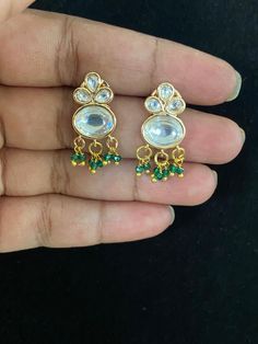 Simple Kundan earrings Festive White Crystal Earrings, Festive Green Pearl Earrings, Green Dangle Earrings For Celebration, Green Dangle Earrings For Festive Occasions, Festive Green Dangle Earrings, Green Round Earrings For Festive Occasion, Green Pearl Drop Earrings For Festive Occasions, Green Drop Pearl Earrings For Festive Occasions, Festive Green Pearl Drop Earrings