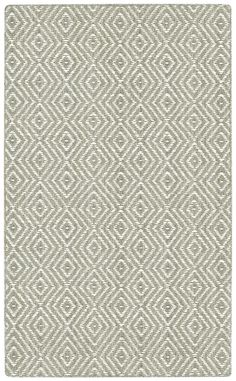 an area rug with diamond design in grey and white