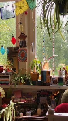 many houseplants and plants are on the windowsill