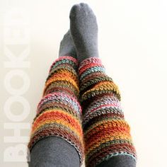 the legs of a person wearing socks with multicolored knits and text above them