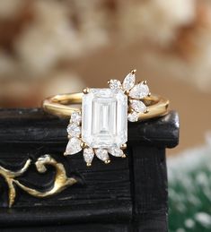 a close up of a diamond ring on a table