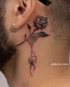 a man with a tattoo on his neck and behind the ear is a spider web